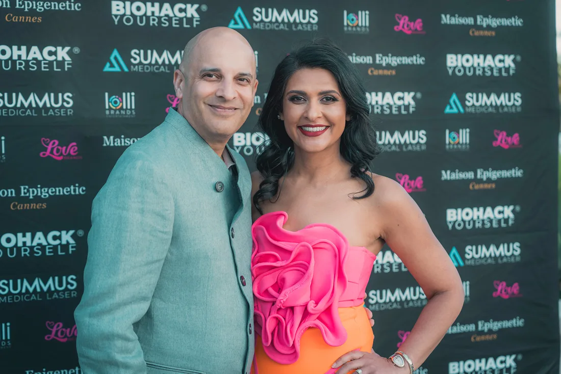 Guests in front of a wall of partner brand logos