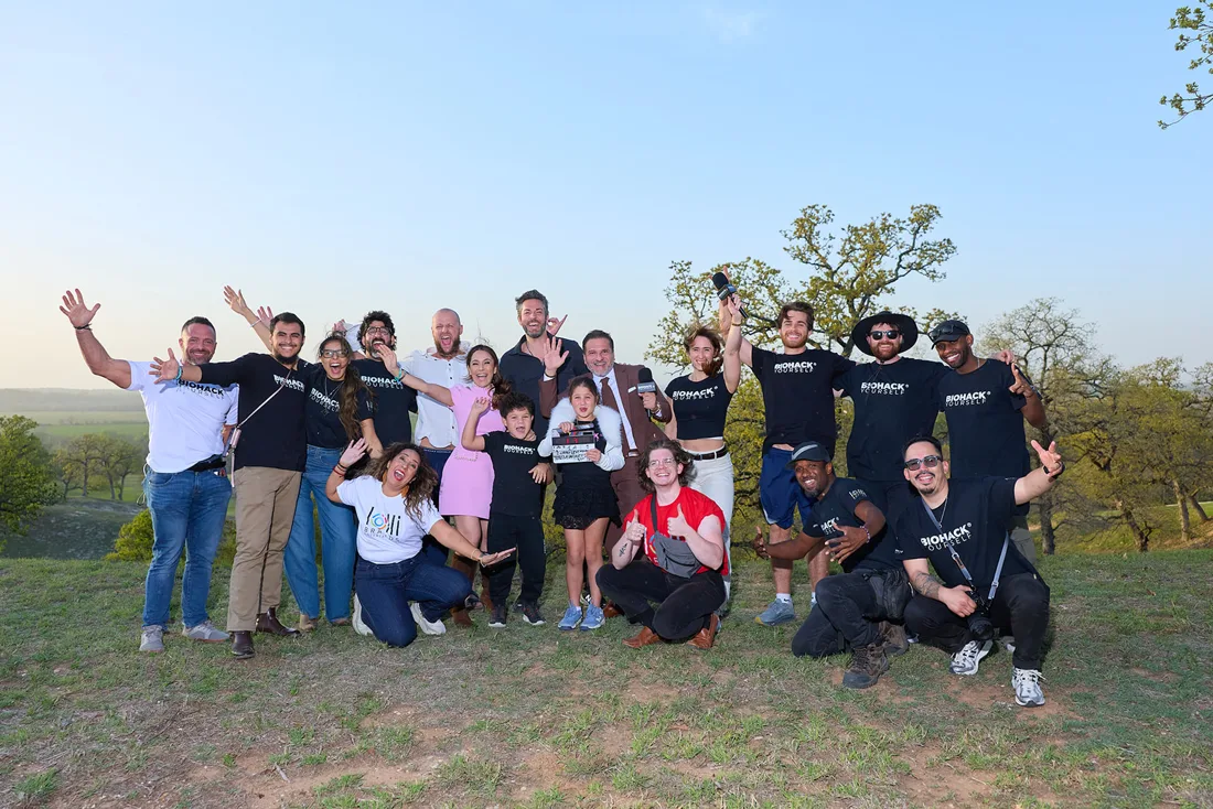 The crew and guests celebrating outdoors on location